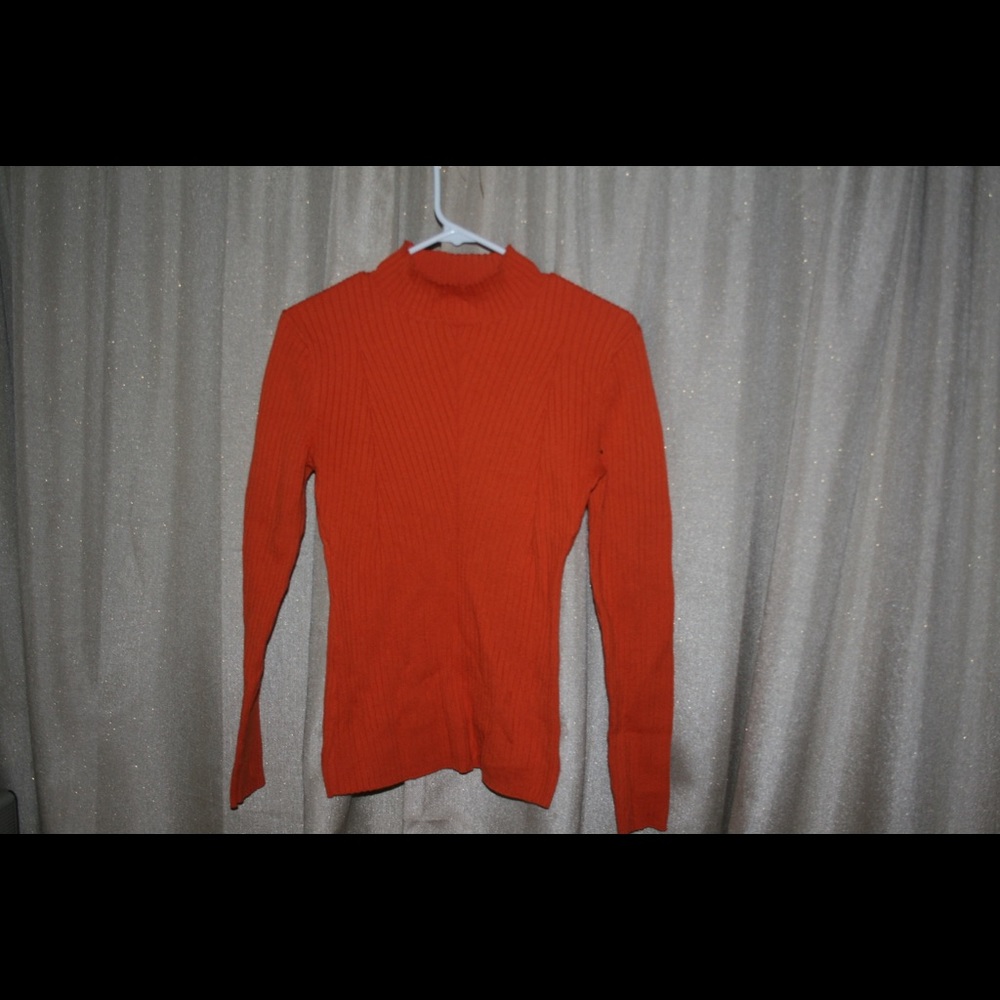 Bright orange turtleneck sweater